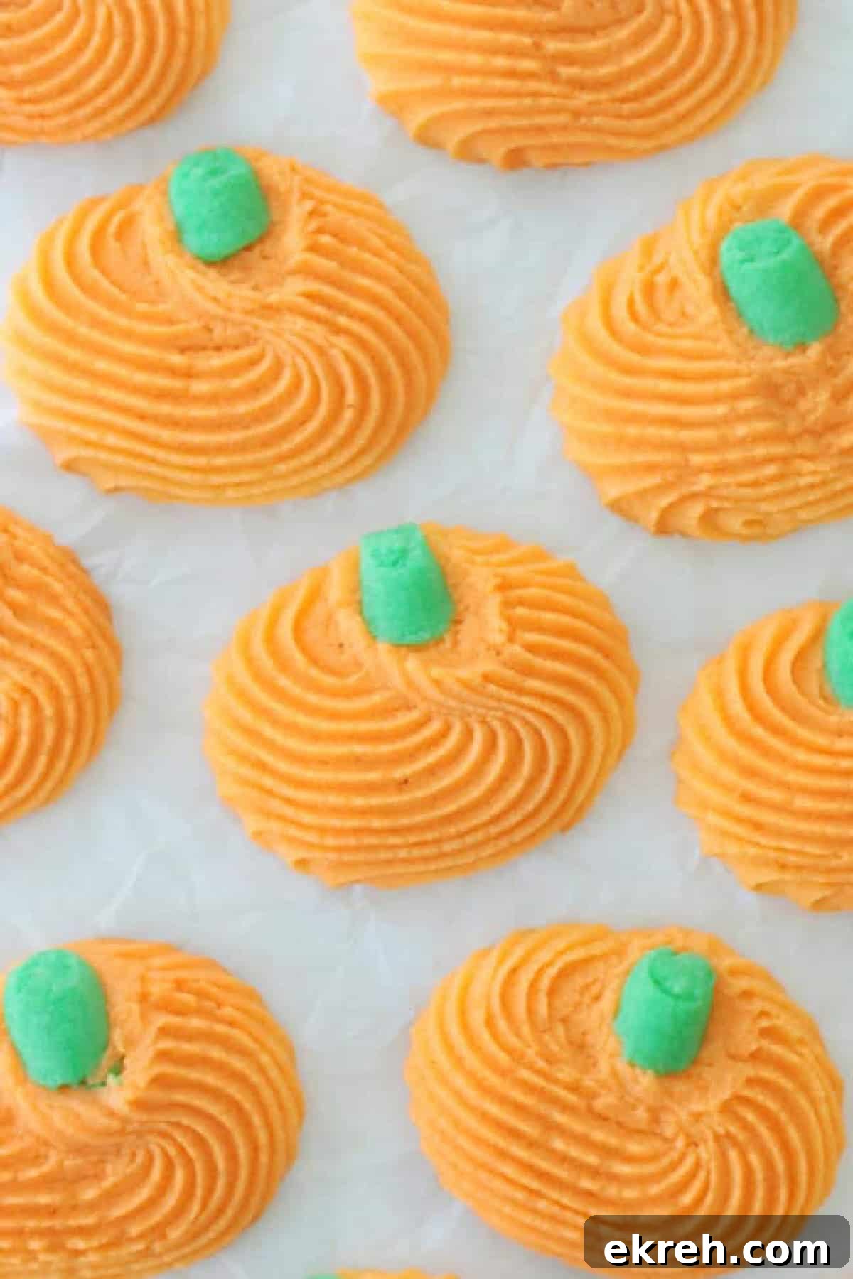 Pumpkin cookies with green stems.