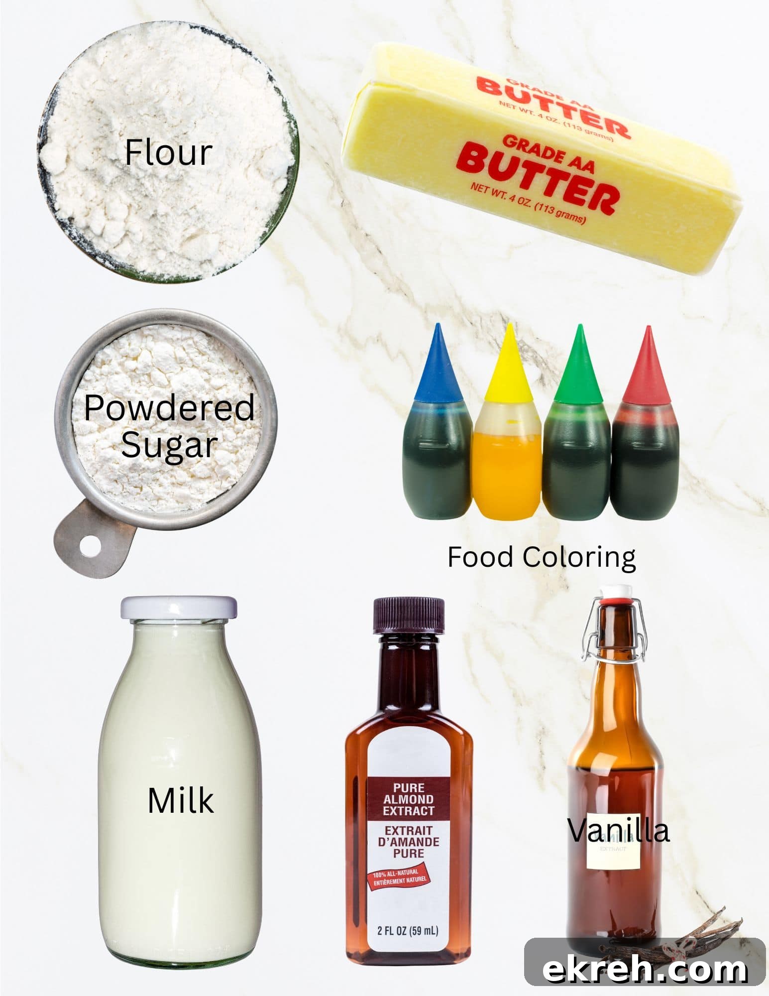 Bowls of flour and powdered sugar, stick of butter, bottle of milk, food coloring, bottles of vanilla and almond extract.