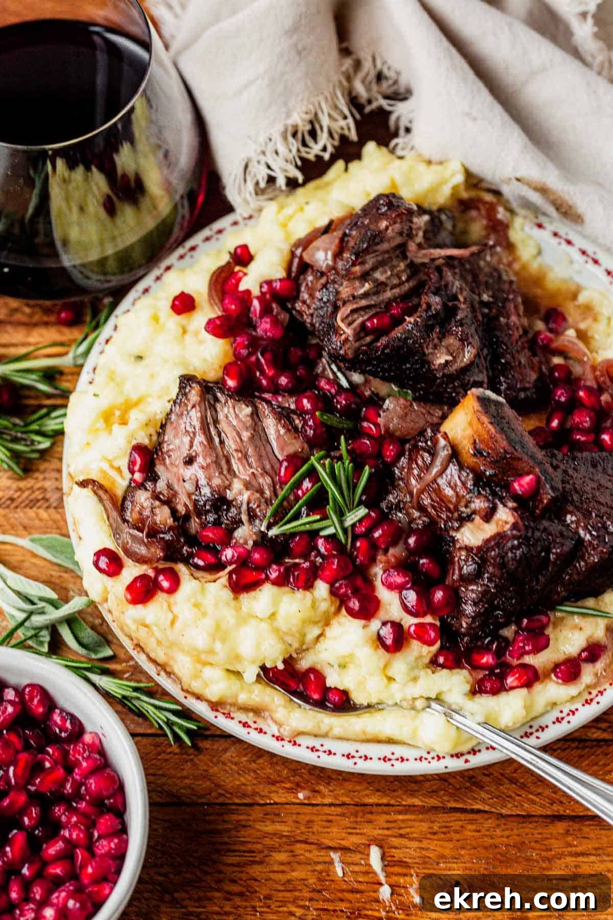 pomegranate short ribs on top of mashed potatoes.