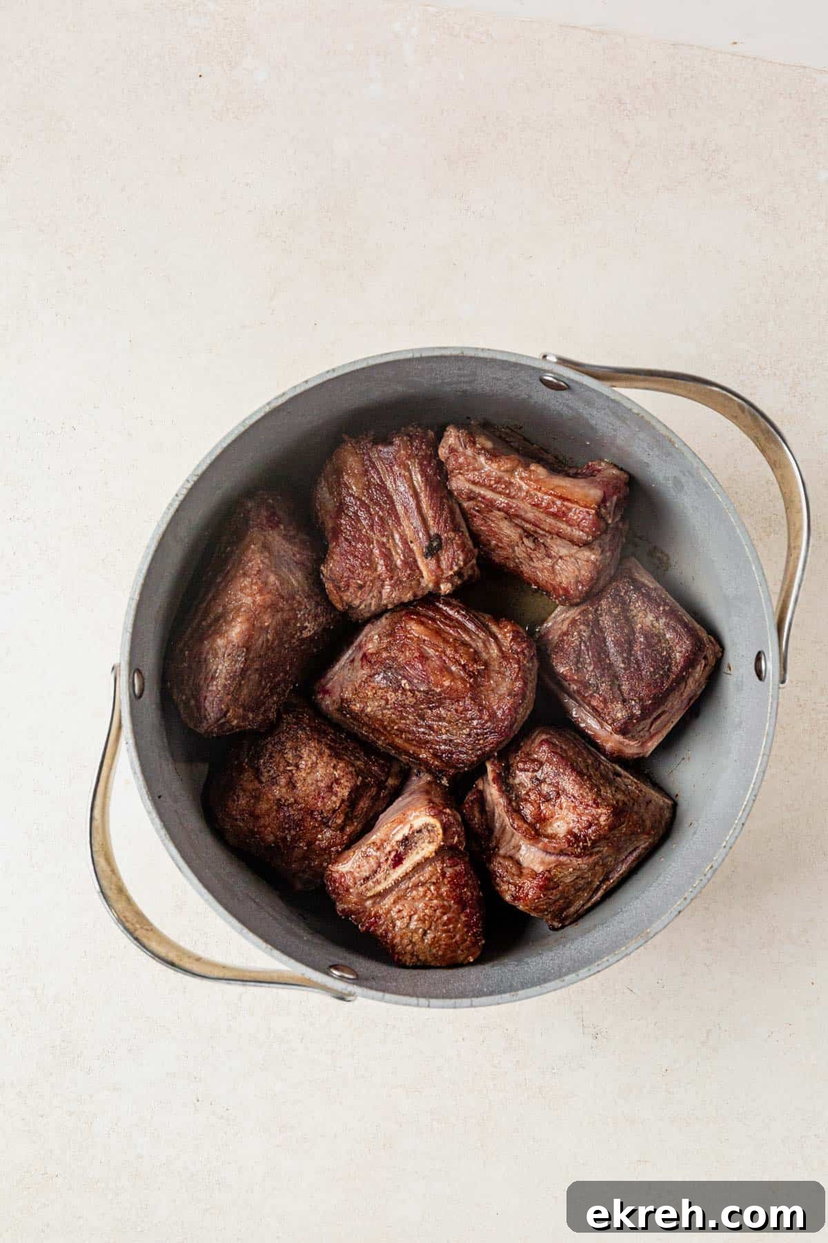 seared short ribs in a dutch oven.