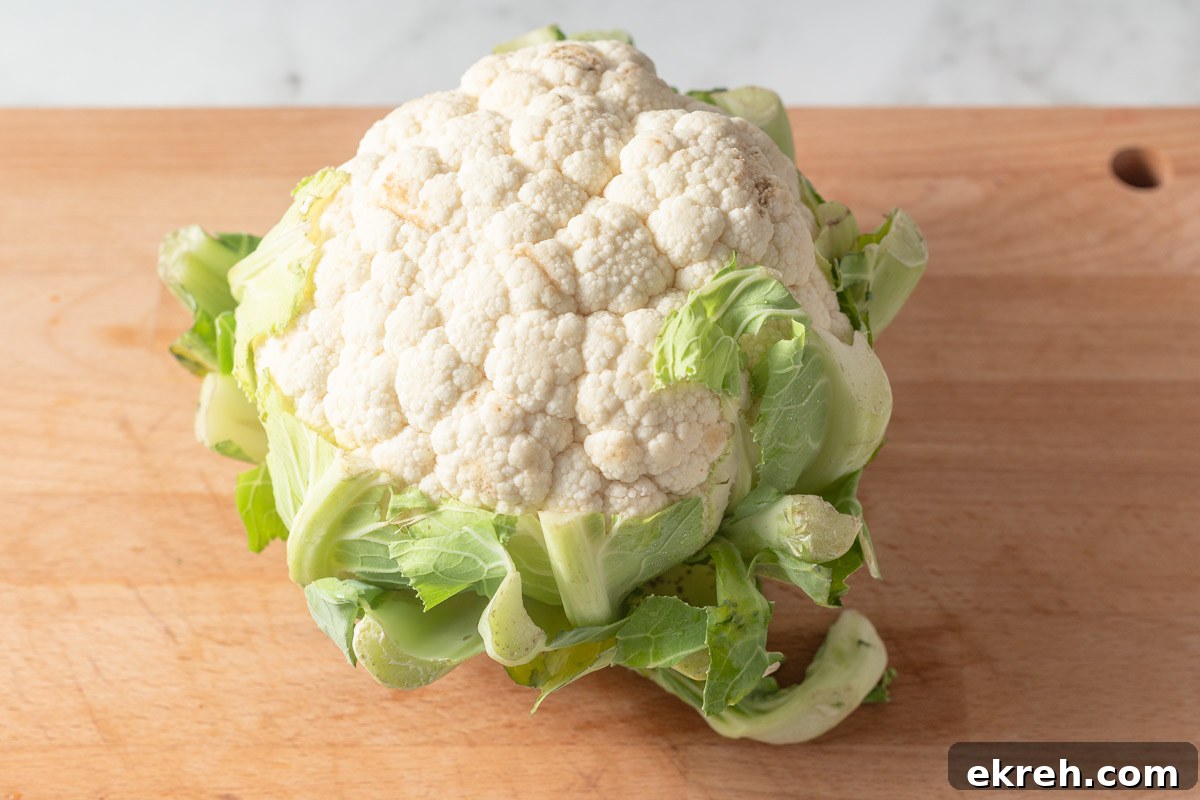 cauliflower on a cutting board.