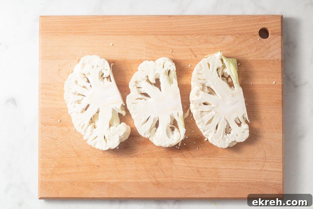 cauliflower steaks on the cutting board.