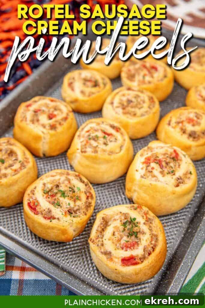 rotel and sausage pinwheels on a baking sheet