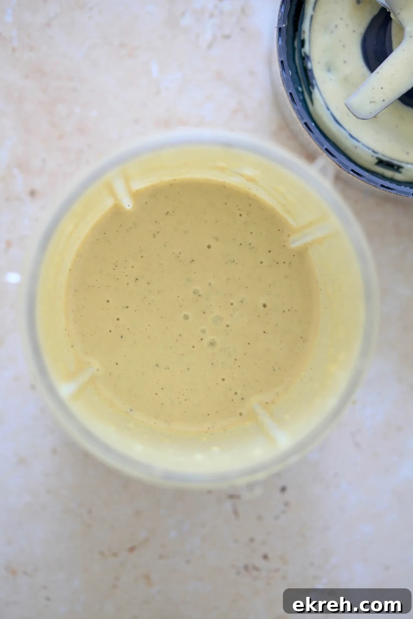 Creamy blended pale dressing in blender jar.