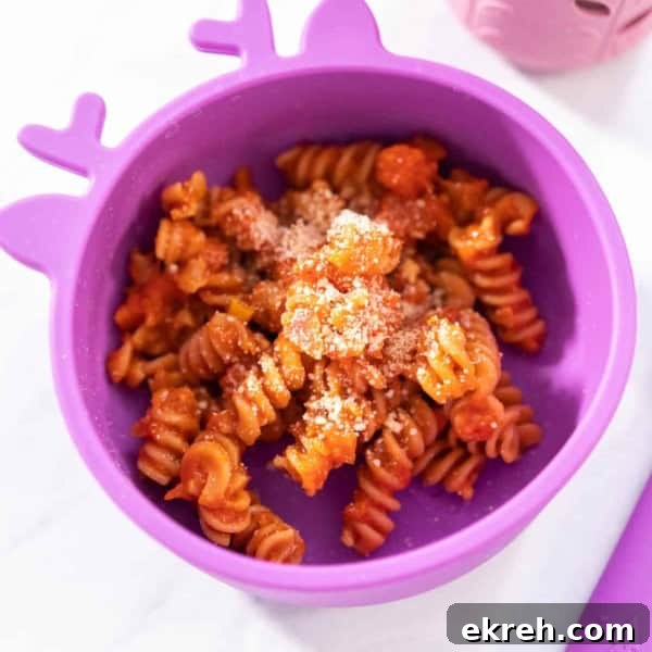 Top-Rated Toddler Plates and Feeding Tools 6 kids' bowl filled with pasta, tomato sauce and cheese sprinkles