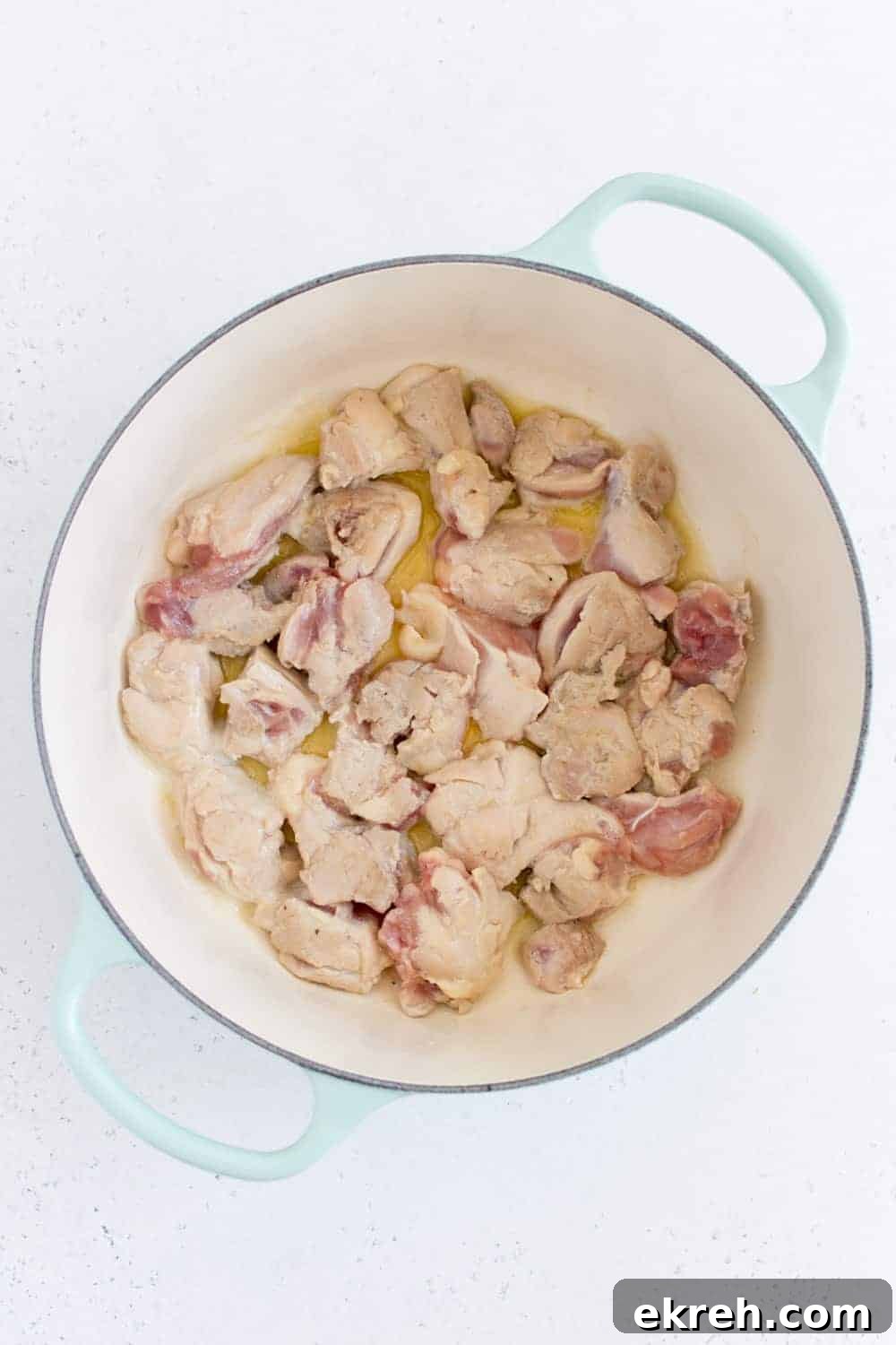 chicken thighs browning in dutch oven