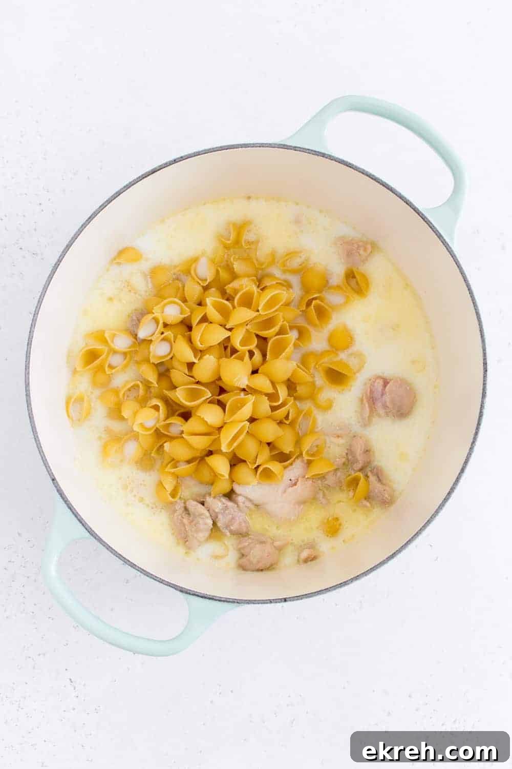 dutch oven with liquid and pasta inside