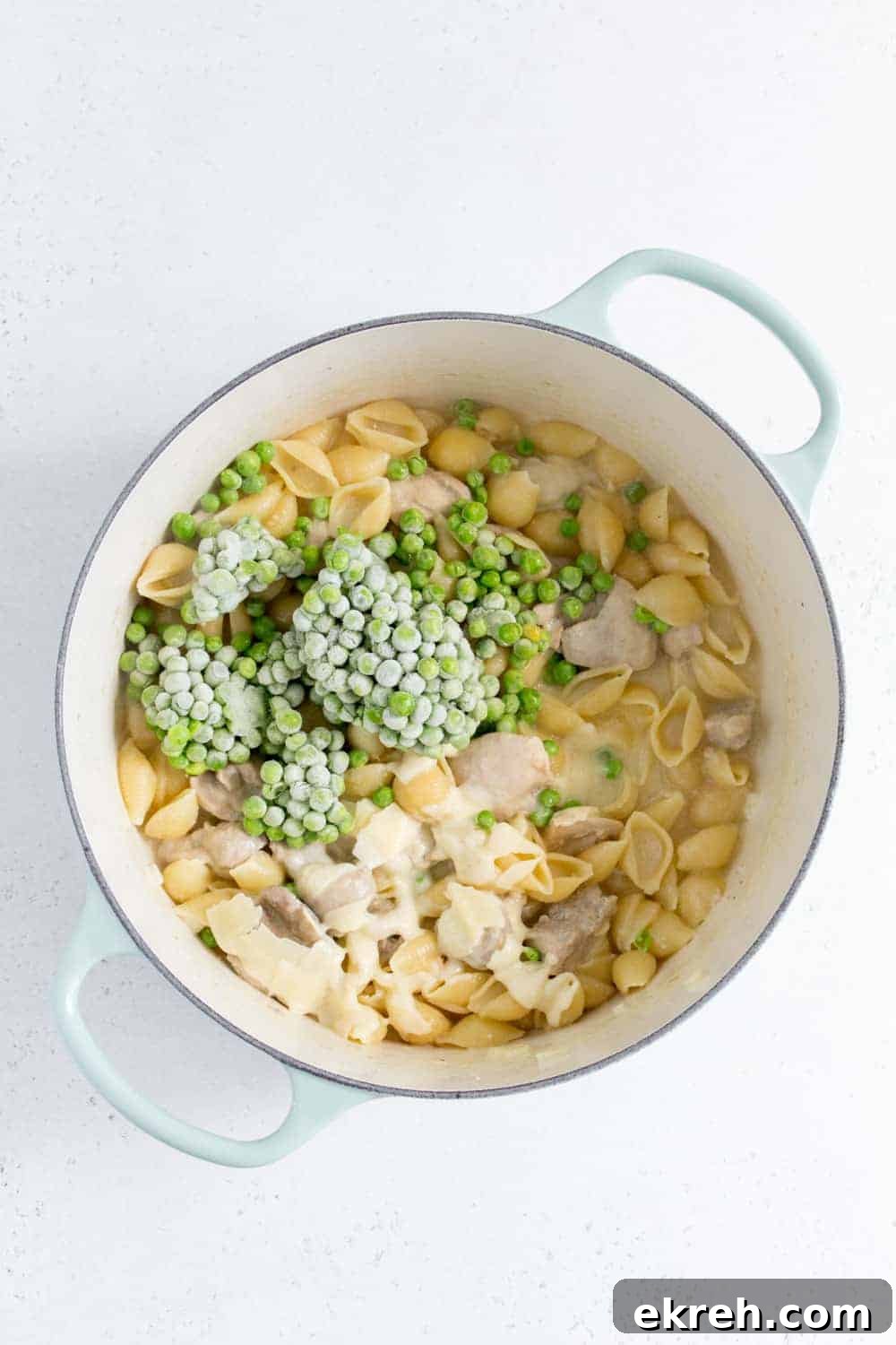 dutch oven with frozen peas and parmesan added inside