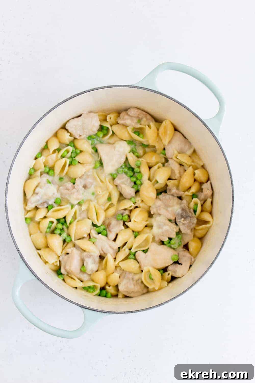 dutch oven with garlic parmesan pasta with peas and chicken