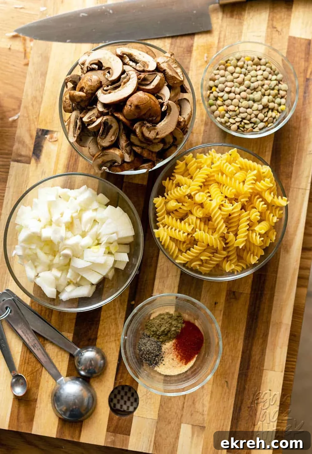 Image of prepped mise en place, on a cutting board, for pasta dish