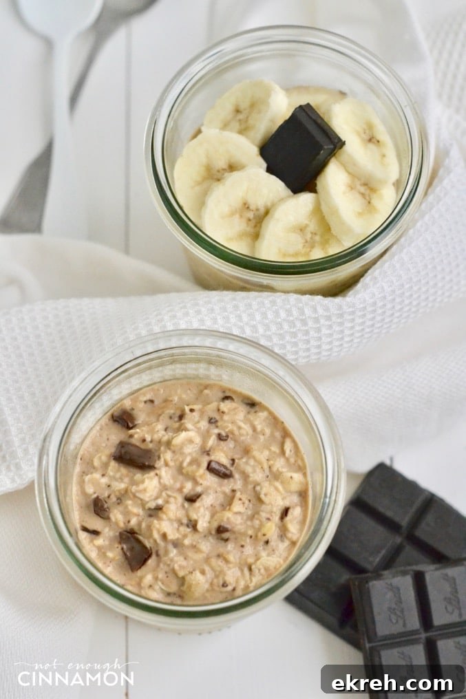 overhead shot of Peanut butter chocolate overnight oats in a mason jar with banana slices and dark chocolate on the side