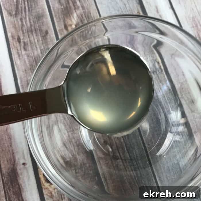 DIY kid-safe hand sanitizer recipe with essential oils - Germs are everywhere. When you can't get to a sink to wash your hands, keep clean with this natural homemade hand sanitizer gel {with essential oils}.