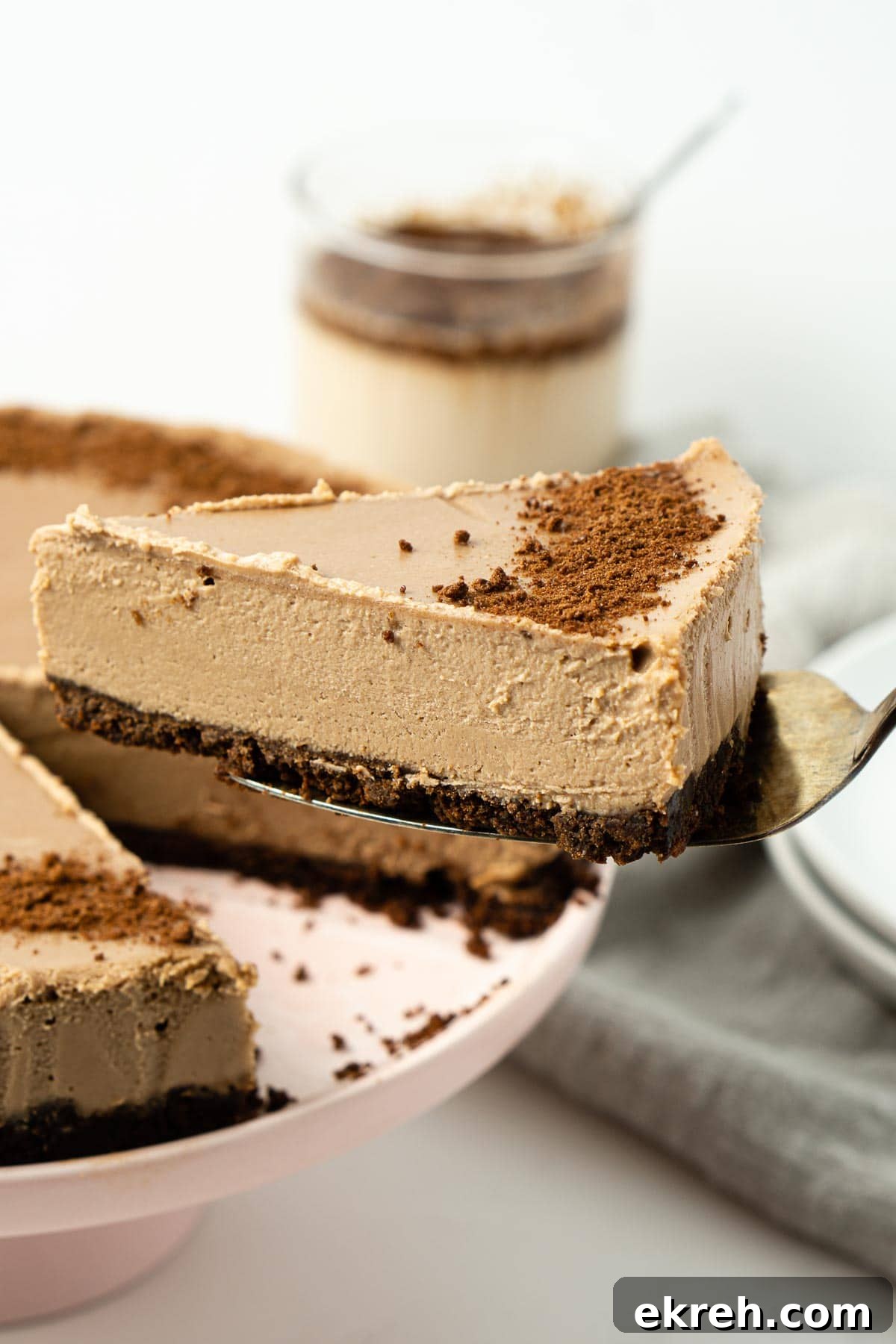 Creamy No-Bake Vegan Milo Cheesecake Recipe 2 Close up of slice of vegan cheesecake being served.