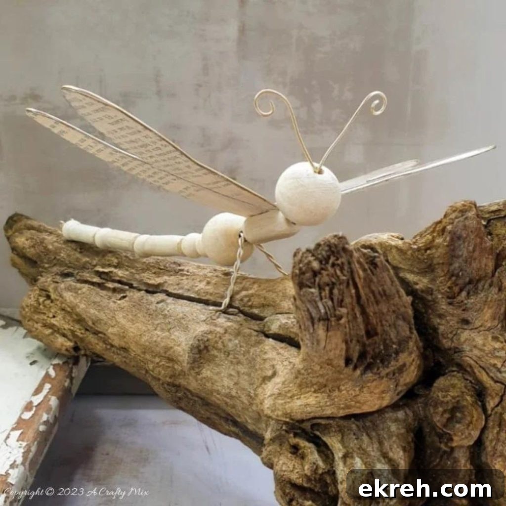 wooden bead dragonfly on a piece of wood