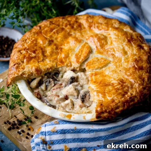 Golden-brown chicken and mushroom pie with flaky pastry