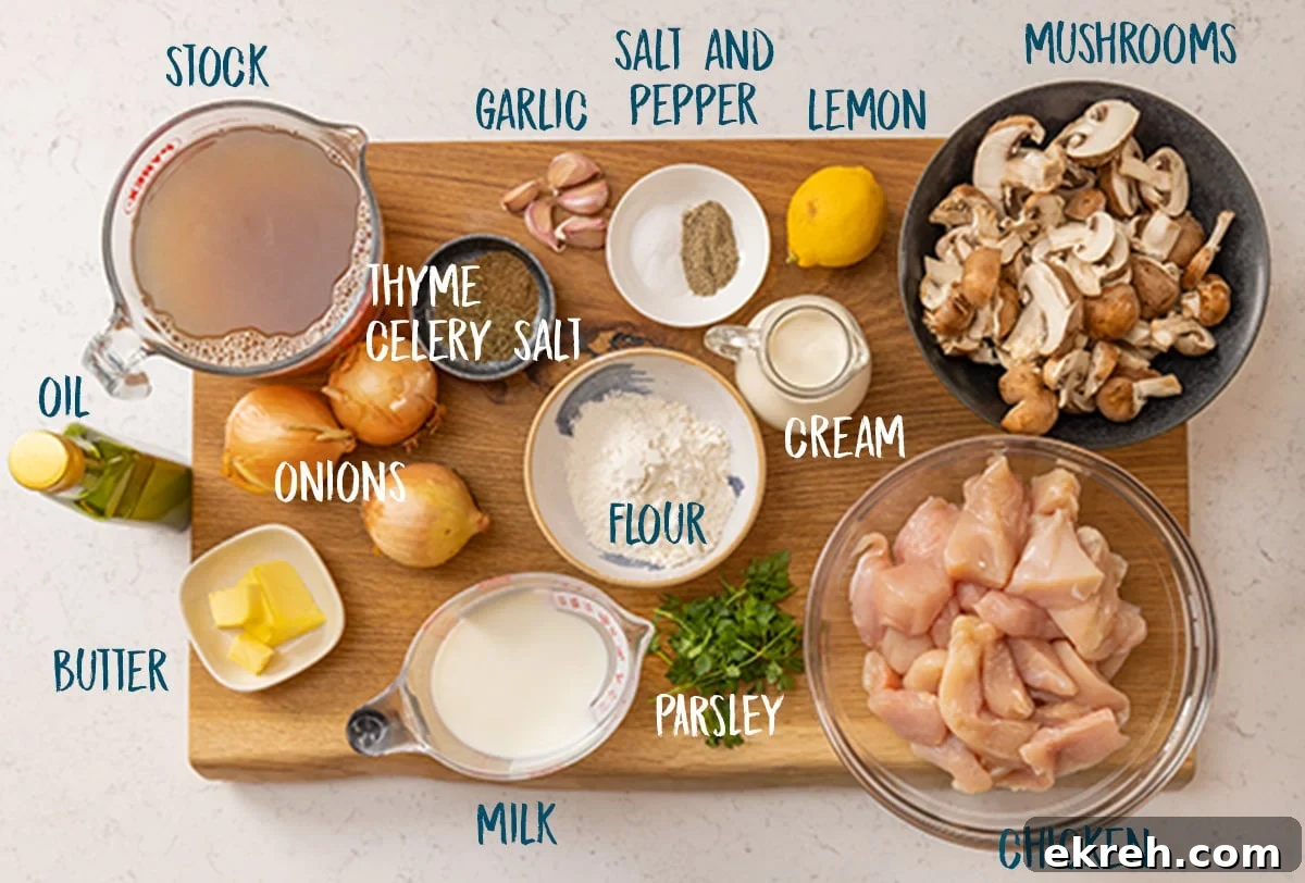 Ingredients for creamy chicken and mushroom casserole on a wooden chopping board against a light background.