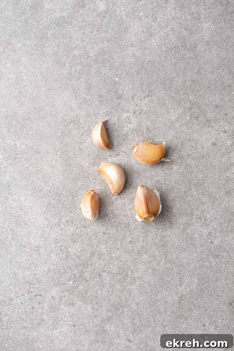 Five unpeeled garlic cloves