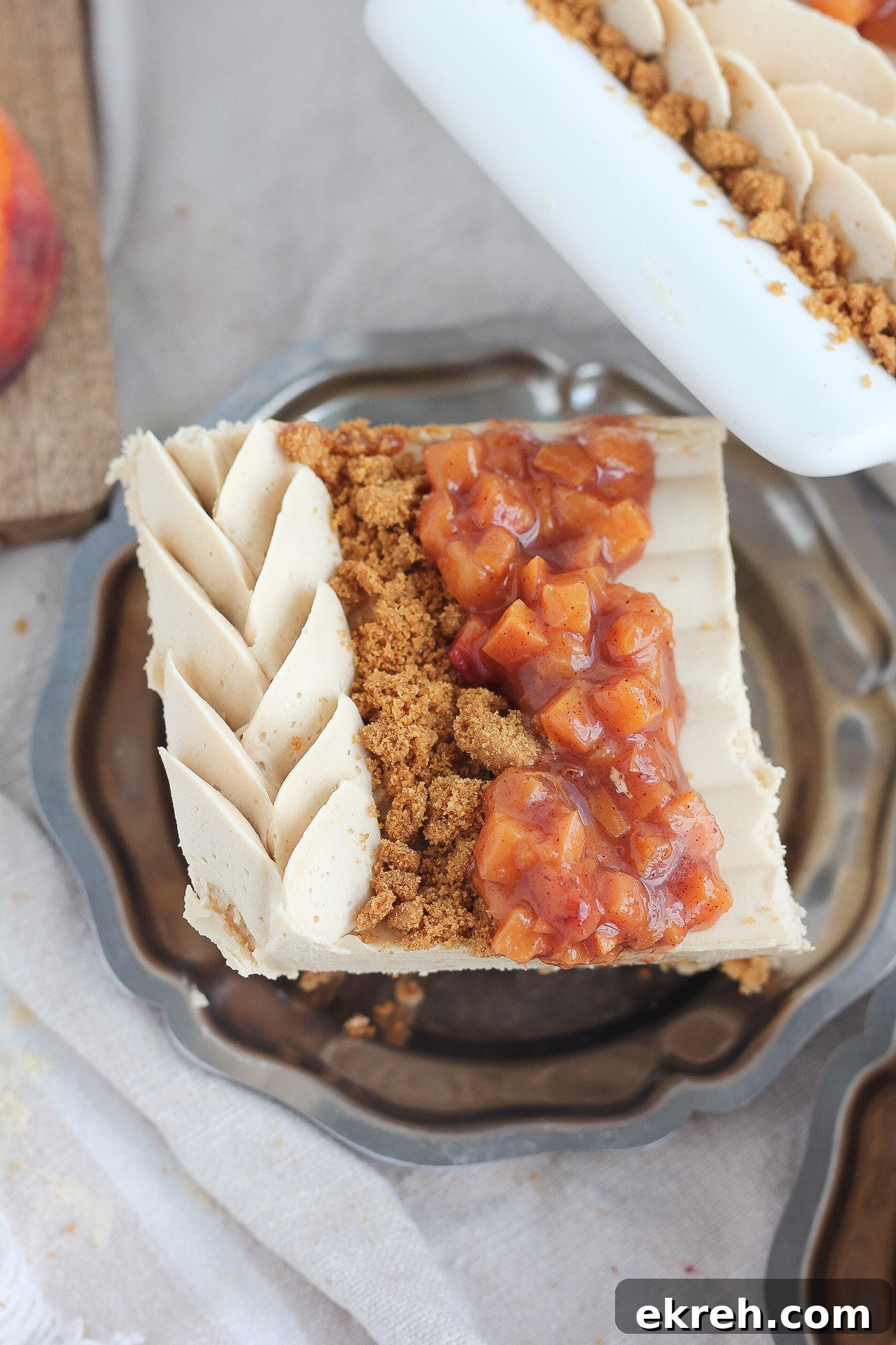 Slice of peach biscoff cake