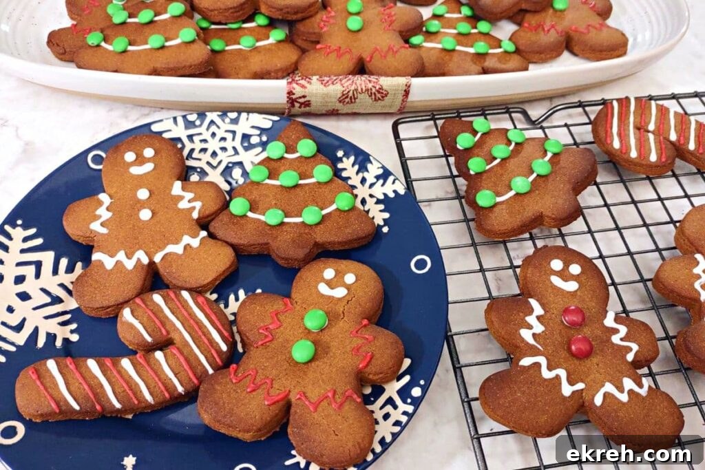 various gingerbread cookies on winter themed plates and platters