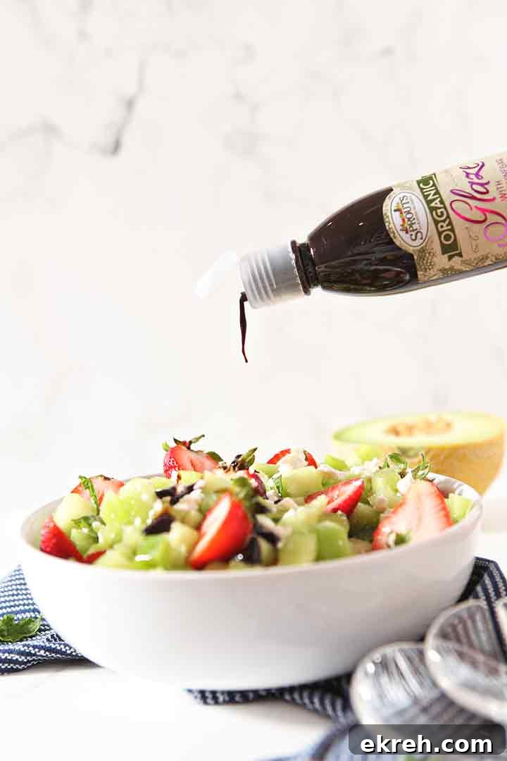 Balsamic glaze is drizzled on top of the salad