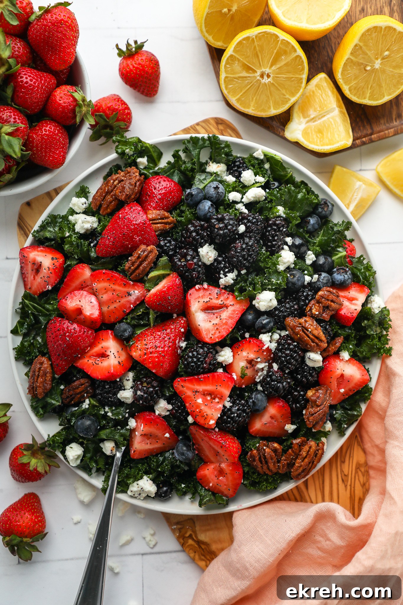 Kale Salad with Mixed Berries and Lemon Poppy Seed Dressing 4 This mixed berry kale salad is perfect to serve for any outdoor party, potluck or bbq this year! It's sweet, creamy and so refreshing too!