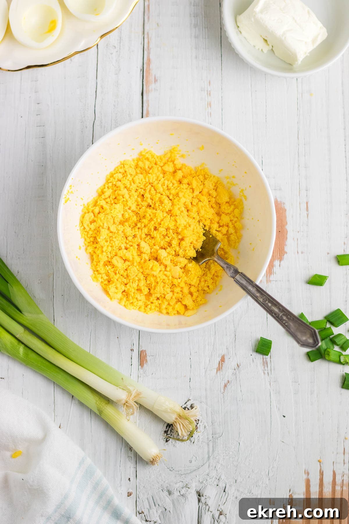 Creamy Ranch Deviled Eggs Recipe 5 Egg yolks crumbled in a mixing bowl.