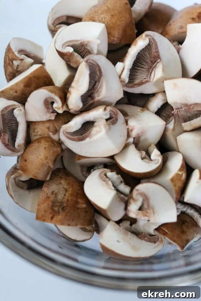 Balsamic-Glazed Mushroom Smorrebrod with White Bean Puree 5 Quartered mushrooms in a bowl