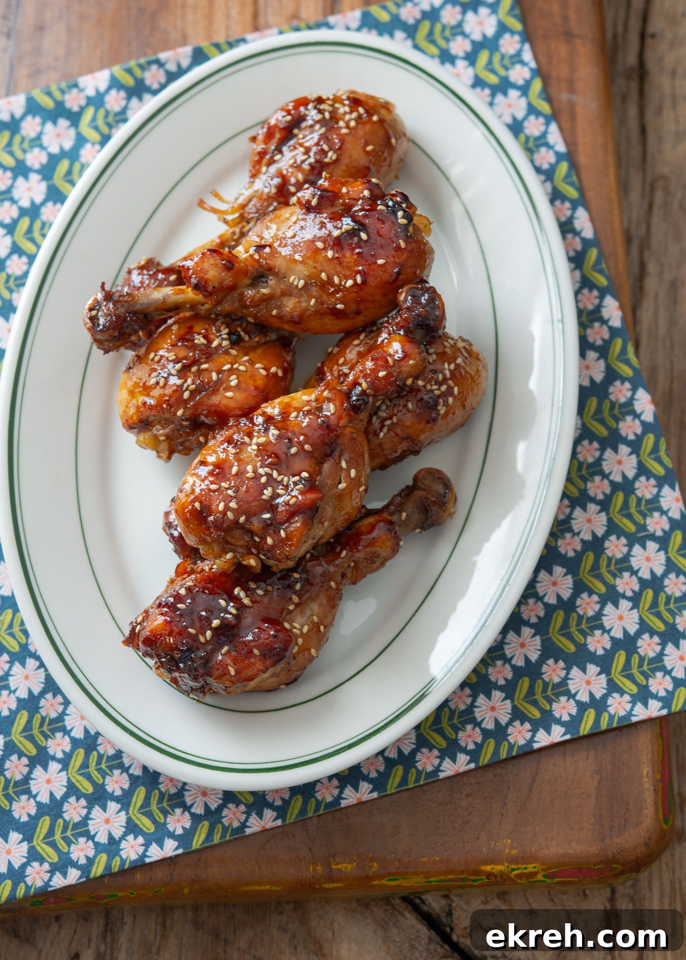Teriyaki chicken drumsticks with glossy, sticky glaze.