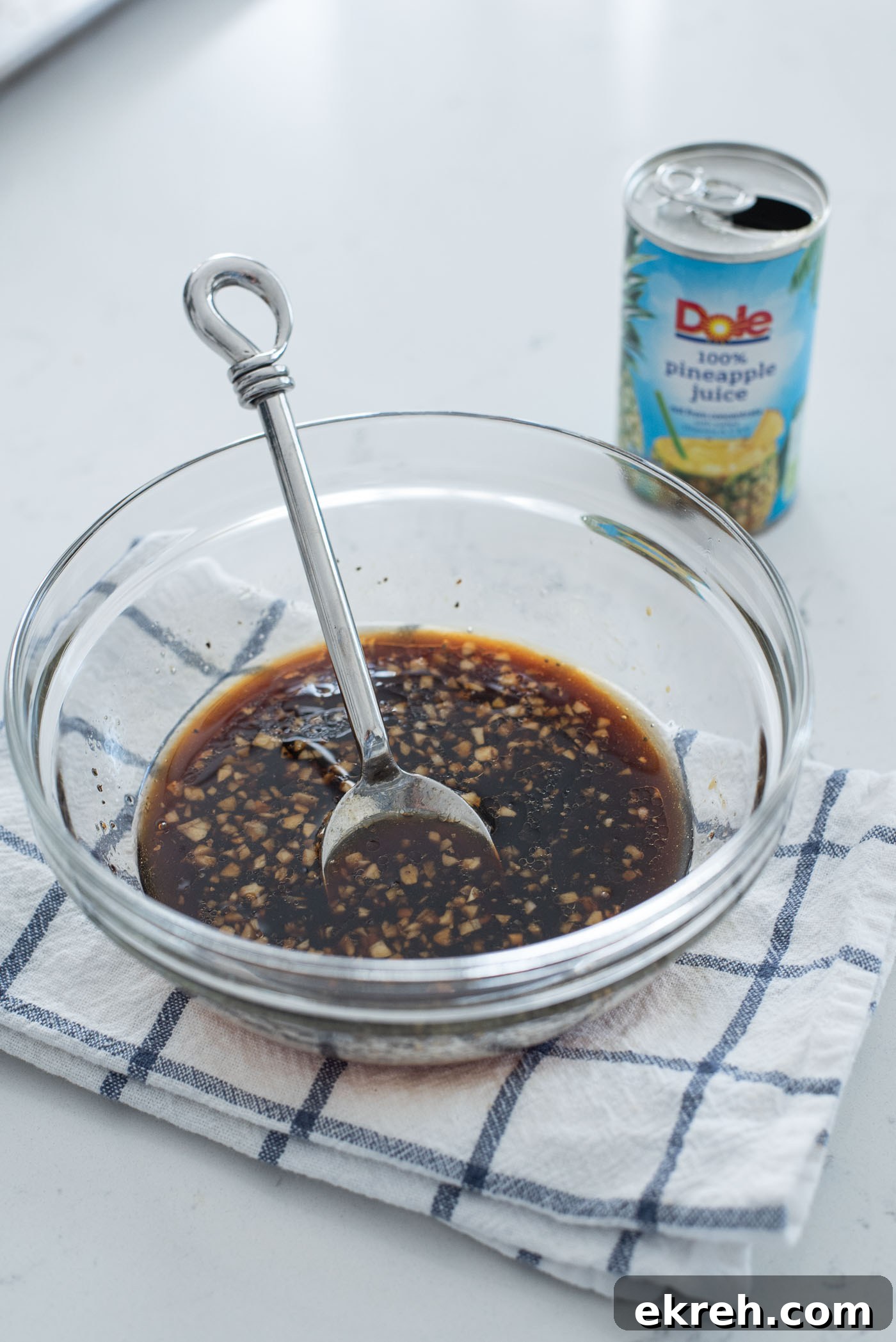 Homemade teriyaki sauce with pineapple juice mixed in a bowl.