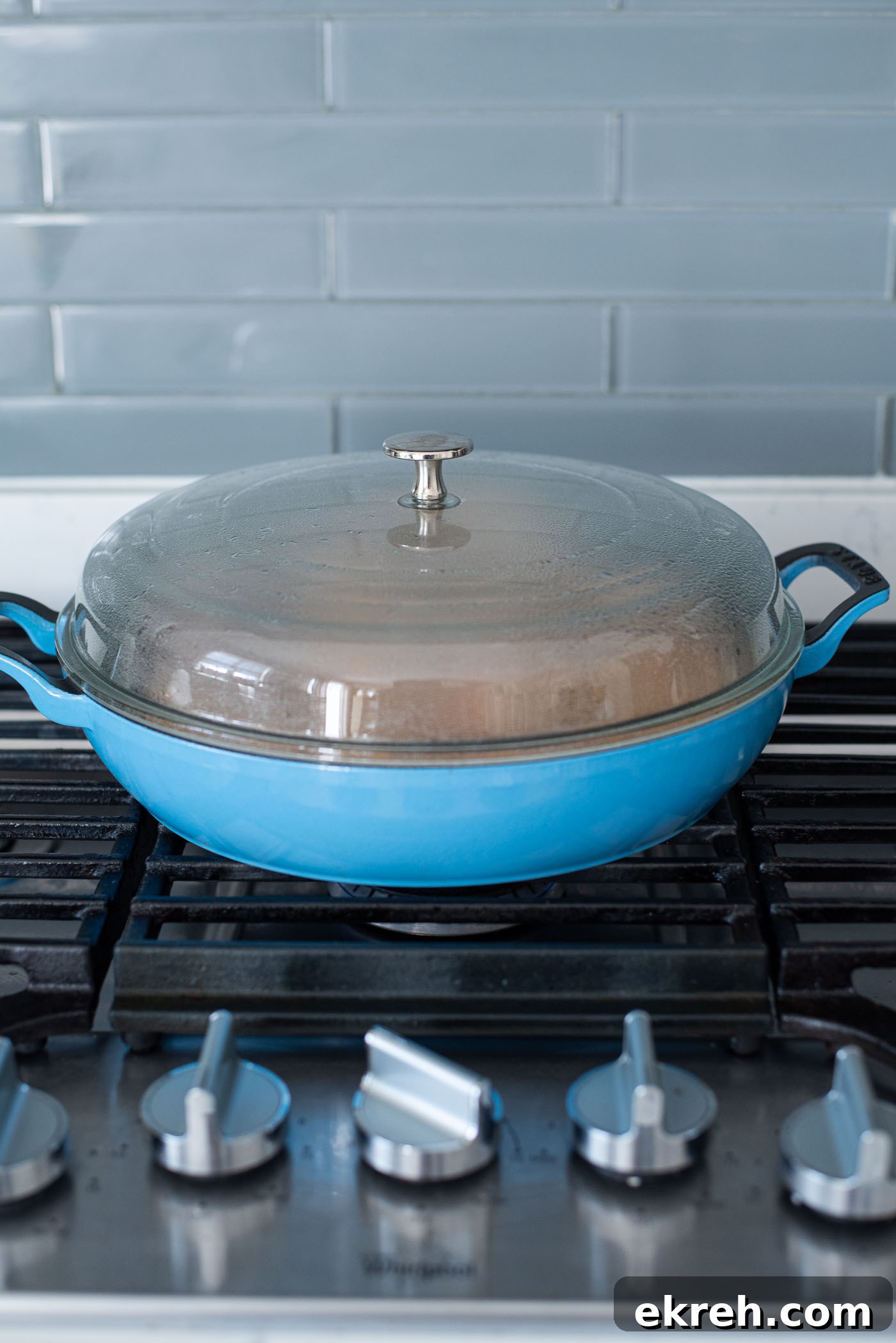 Stove top teriyaki chicken simmering in a pan.